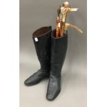 A pair of vintage riding boots and crops