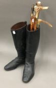 A pair of vintage riding boots and crops