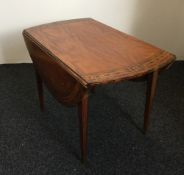 A 19th century satin wood Pembroke table with inlaid decoration including brass