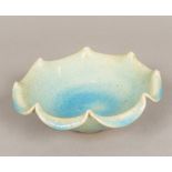 A Chinese Song type porcelain bowl, with shaped rim and allover bluish glaze. 20 cm diameter.