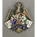A silver enamel eagle pendant