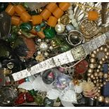 A tin of costume jewellery