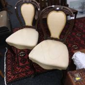 A pair of Victorian upholstered balloon back chairs