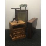 A small chest of drawers, a drop leaf table, a display cabinet,