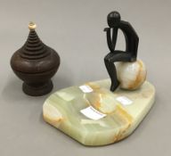 A Hagenauer type onyx and bronze stud dish depicting a pensive figure sitting on an onyx sphere