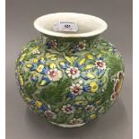 A Persian pottery florally decorated vase