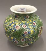 A Persian pottery florally decorated vase