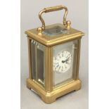 A silver faced miniature carriage clock