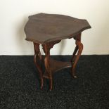 A Victorian poker work decorated two tier side table