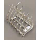 A silver plated rifle toast rack