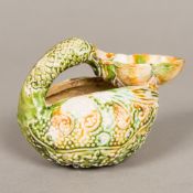 A Chinese porcelain brush wash, modelled as a duck, with allover mottled glaze. 11 cm wide.