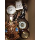 A quantity of clocks and barometers