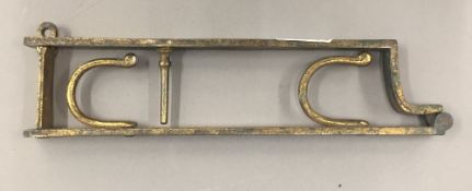 A 19th century gilt brass lock rack,