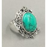 A silver and turquoise ring