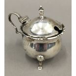 A silver mustard pot