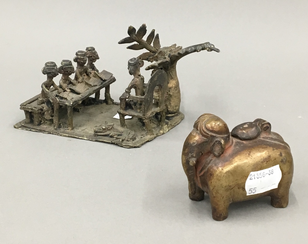 A 19th century brass inkpot in the form of an elephant and an Indian bronze group of school
