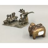 A 19th century brass inkpot in the form of an elephant and an Indian bronze group of school