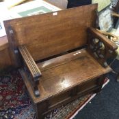 A late 19th/early 20th century oak monk's bench