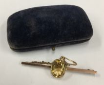 An Antique 9 ct gold and citrine bar brooch and safety chain (5.