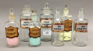 A quantity of glass apothecary jars