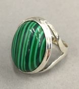 A silver and malachite ring