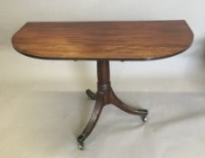 A mahogany D-end table
