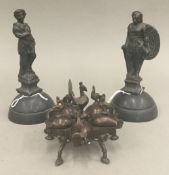 An Eastern bronze inkwell and two cast metal figures