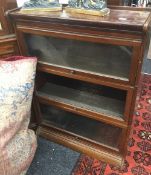 A mahogany three tier Globe Wernicke type bookcase