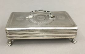 A Dutch silver lidded trinket box with swing handle,