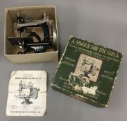 A boxed Singer For The Girls Sewing machine