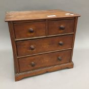A late 19th/early 20th century miniature mahogany chest of drawers