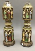 A pair of Eastern carved and painted lamp bases