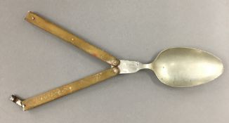 A 19th century horn handled folding travel spoon