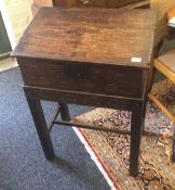 An 18th century carved oak Bible box on a stand