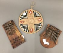 Two African instruments and an African art hanging