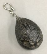 A small carved coconut key ring