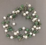 A silver jade and pearl bracelet