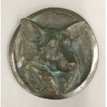 A bronze roundel,