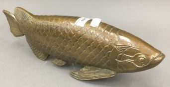 A brass model of a carp