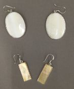 Two pairs of silver and shell earrings