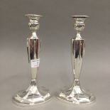 A pair of vintage sterling silver candlesticks, stamped WM Wise,