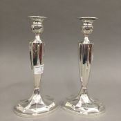 A pair of vintage sterling silver candlesticks, stamped WM Wise,