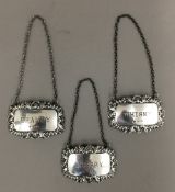 Three silver decanter labels