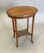 An Edwardian mahogany occasional table