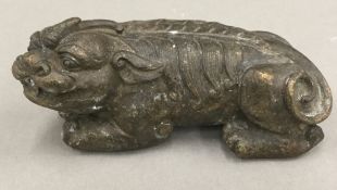 A bronze dog-of-fo scroll weight