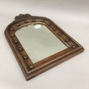 A 19th century carved oak arched mirror