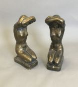 A pair of decorative kneeling female nude figures