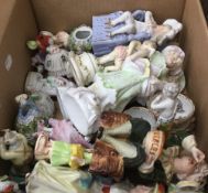 A box of various porcelain figurines