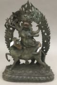 A bronze model of a deity on horse back