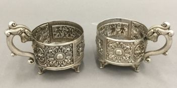 Two Chinese white metal cup holders